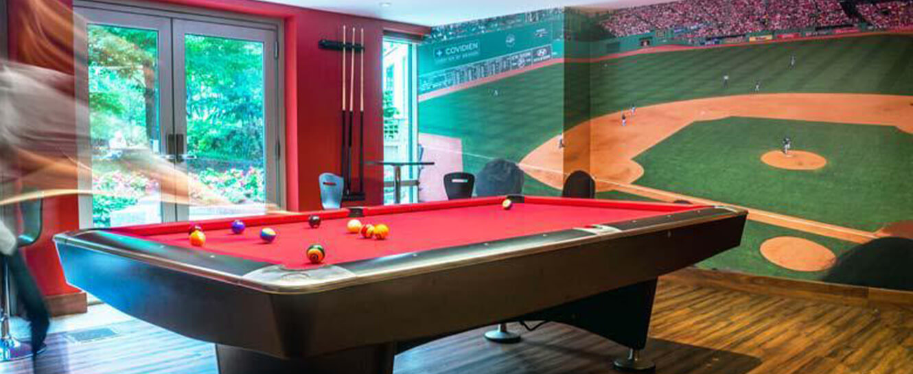 Person playing pool in a game room